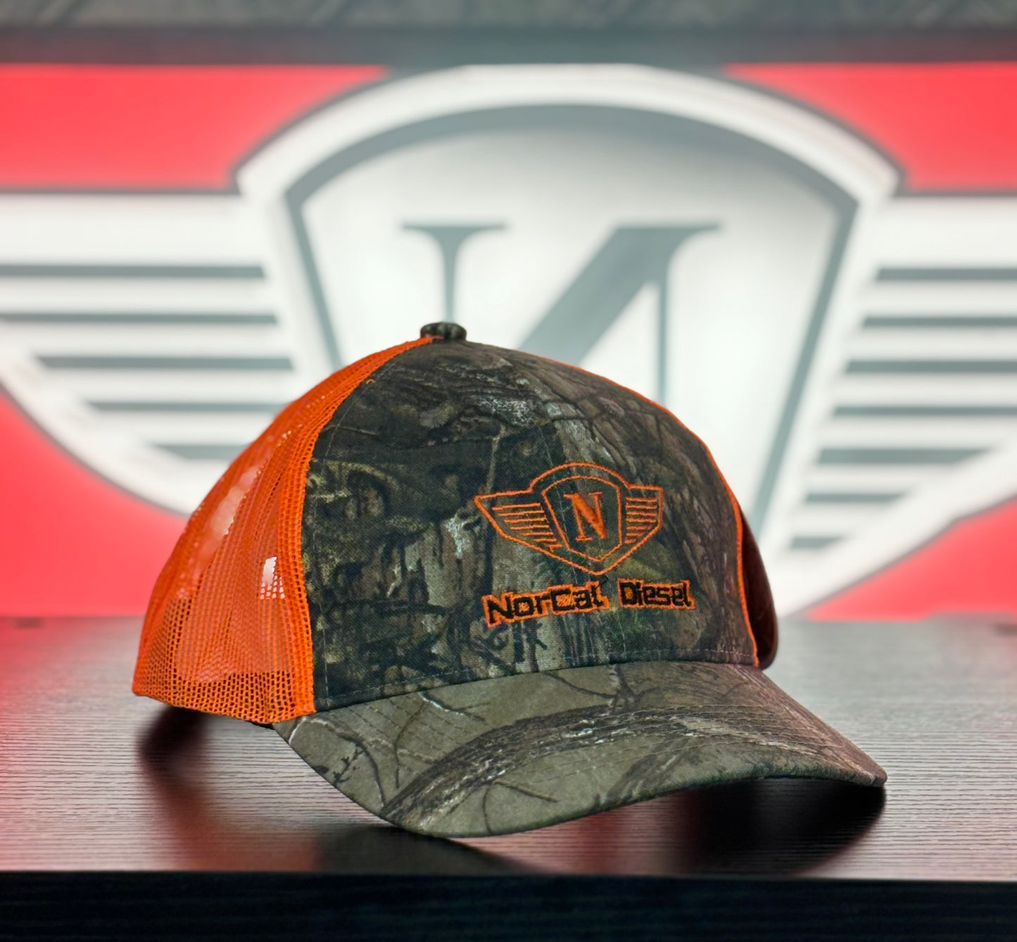 NORCAL DIESEL CAMO TRUCKER HAT W/ORANGE MESH